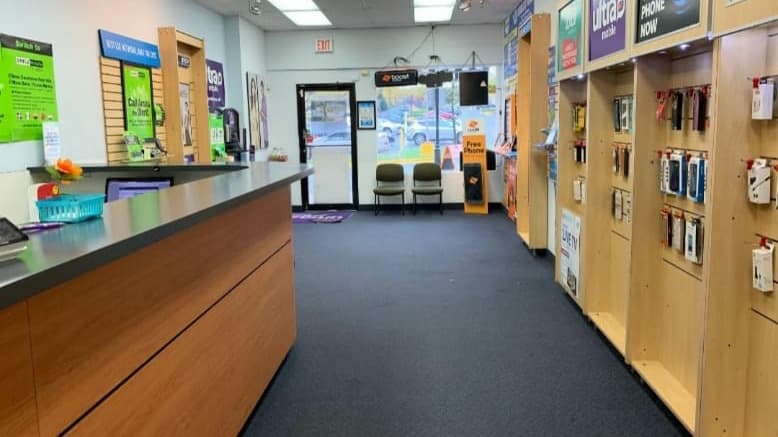 Inside the Briggs Chaney store: the service counter on the left and a wall of phone accessories on the right